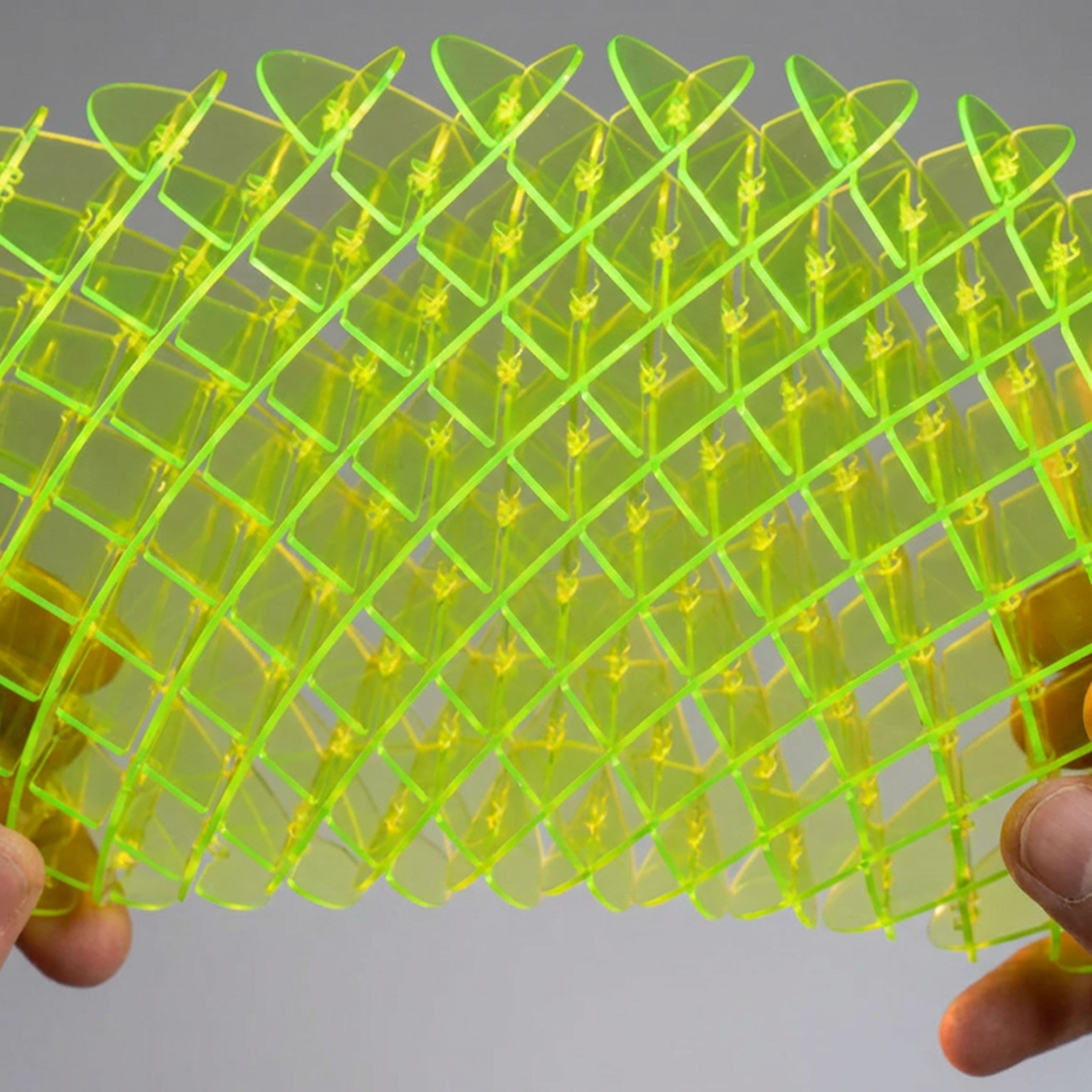 Close-up of the green mesh structure of The Warp Worm showing its flexible engineering design